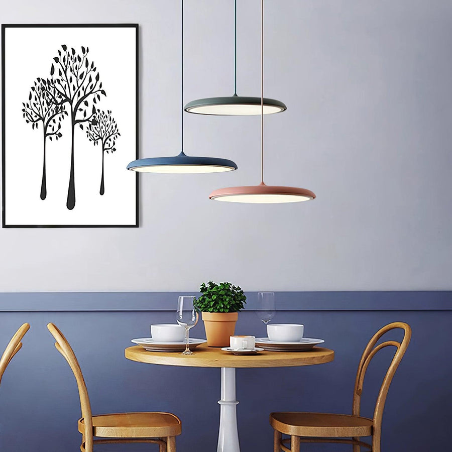 Pendant light mounted above a dining table