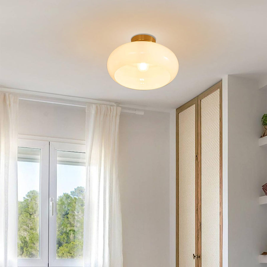 Round ceiling light fixture with amber accents