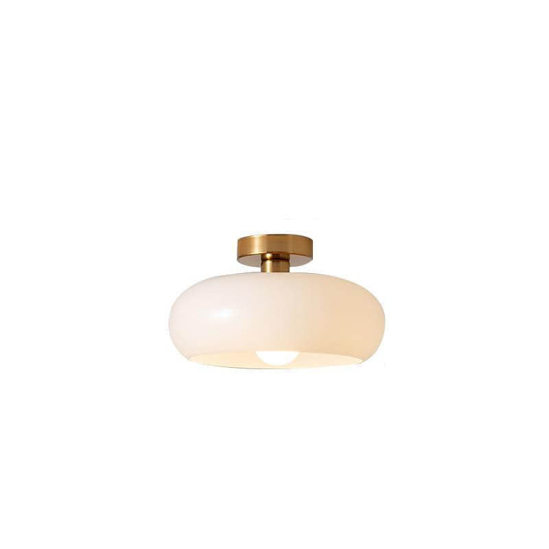 Round ceiling light casting warm ambient glow