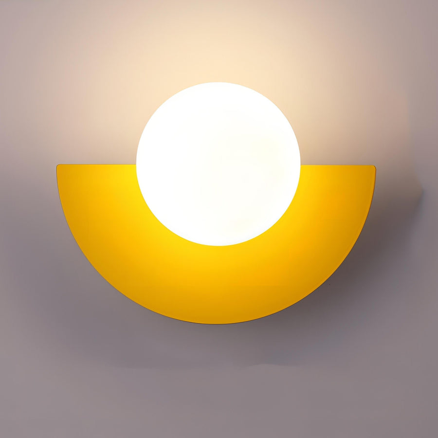 Wall lamp glowing with cool white light in a bedroom