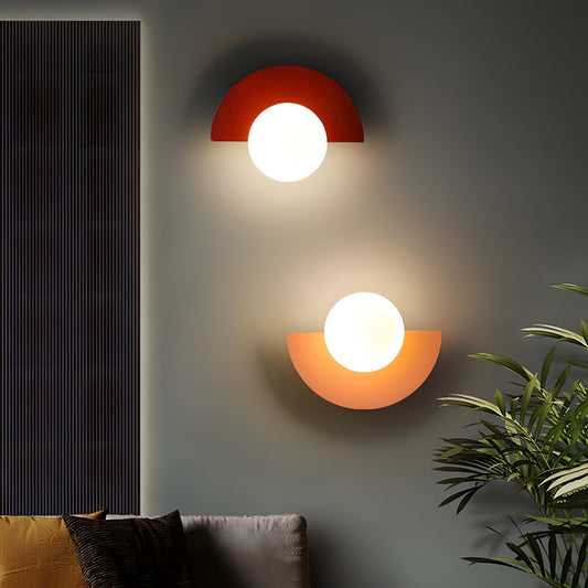 Half-circle LED wall lamp mounted on a white wall