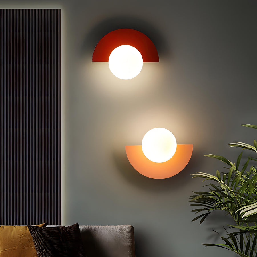 Half-circle LED wall lamp mounted on a white wall