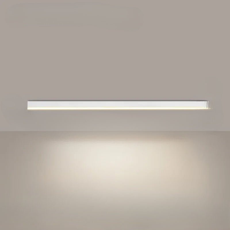 Linear LED ceiling light glowing with cool white light