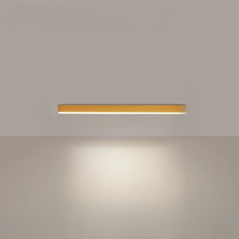 Linear LED ceiling light in a minimalist dining room