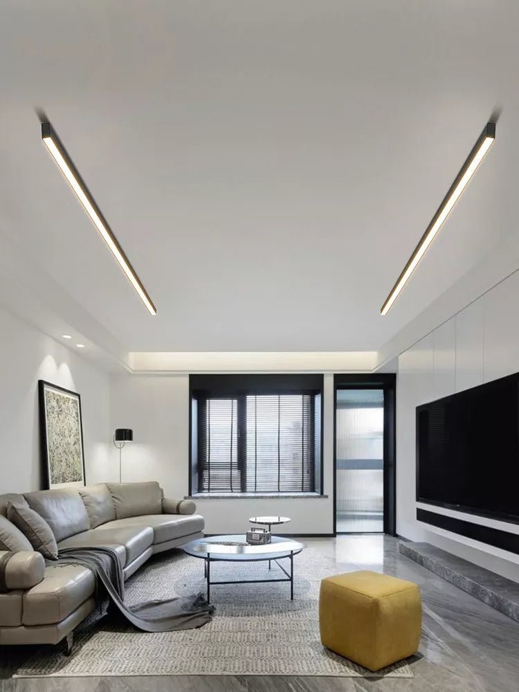 Modern linear LED ceiling light installed in a bright living room