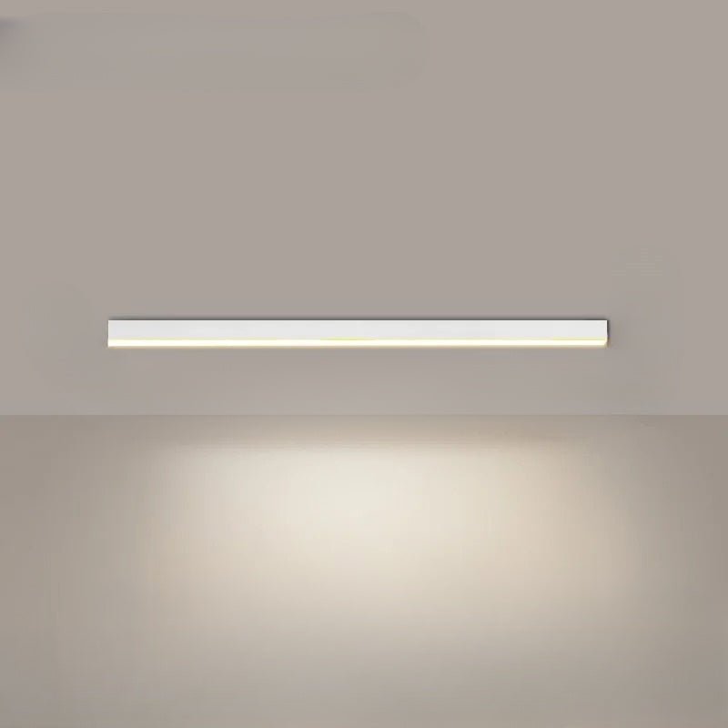 Linear LED ceiling light glowing with neutral white light