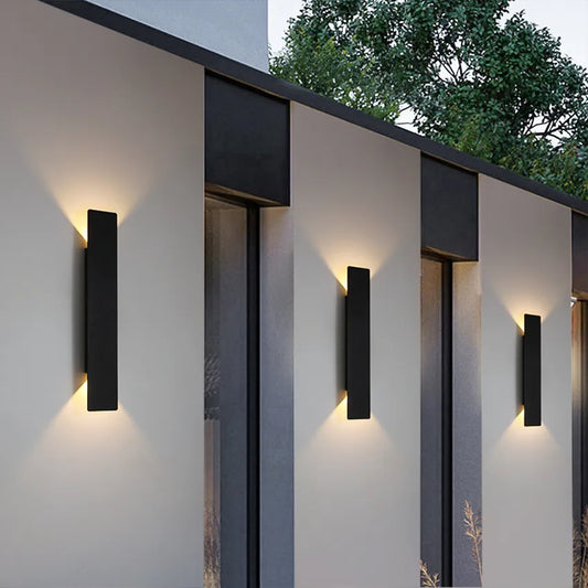 Outdoor LED wall light mounted on a white wall
