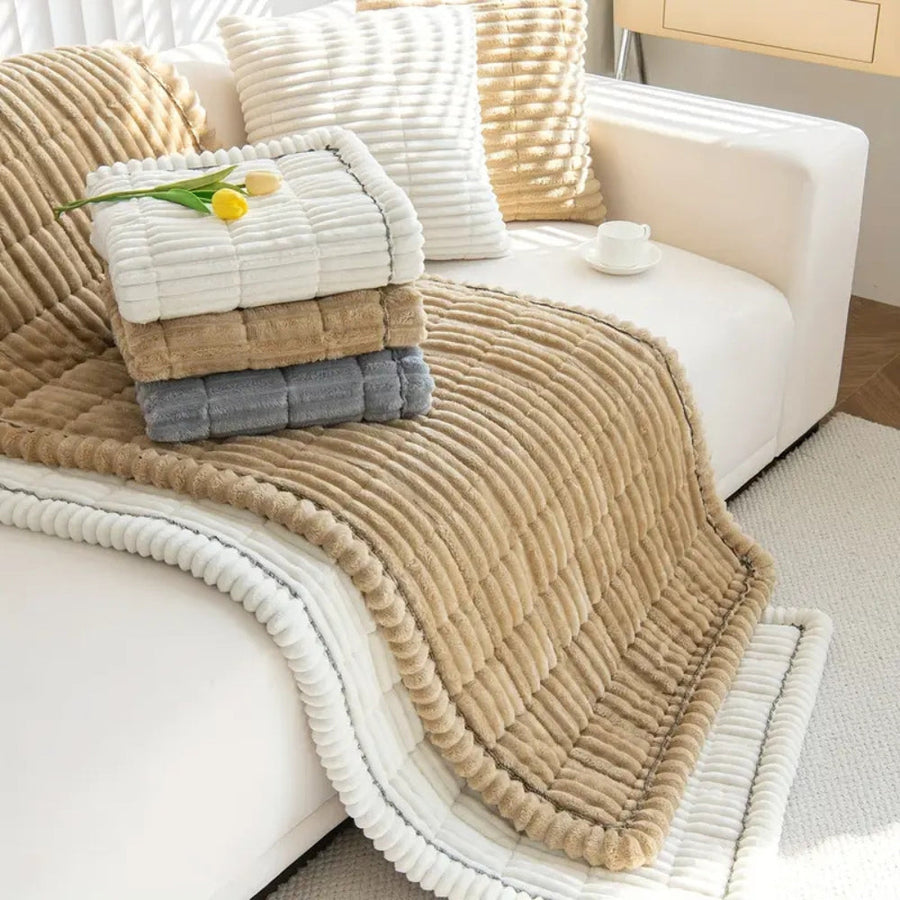 Sofa cover draped over an armchair