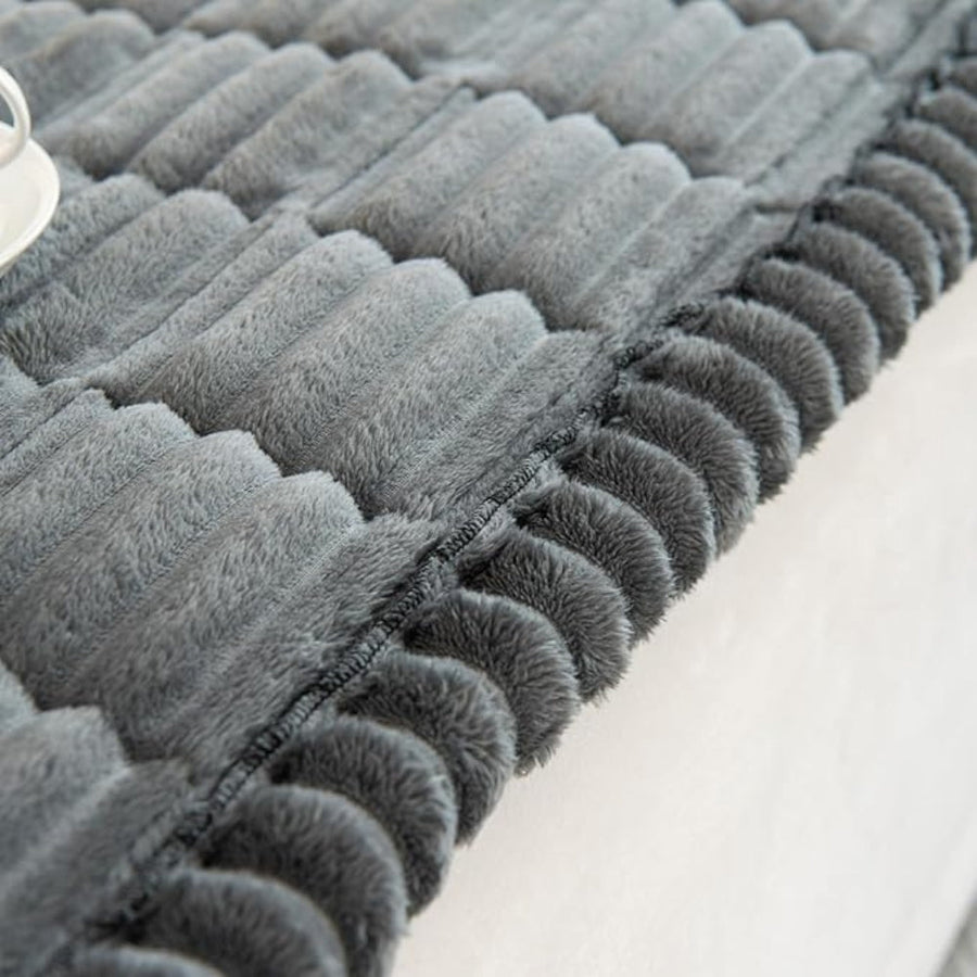 Sofa cover fitted on a three-seat sofa