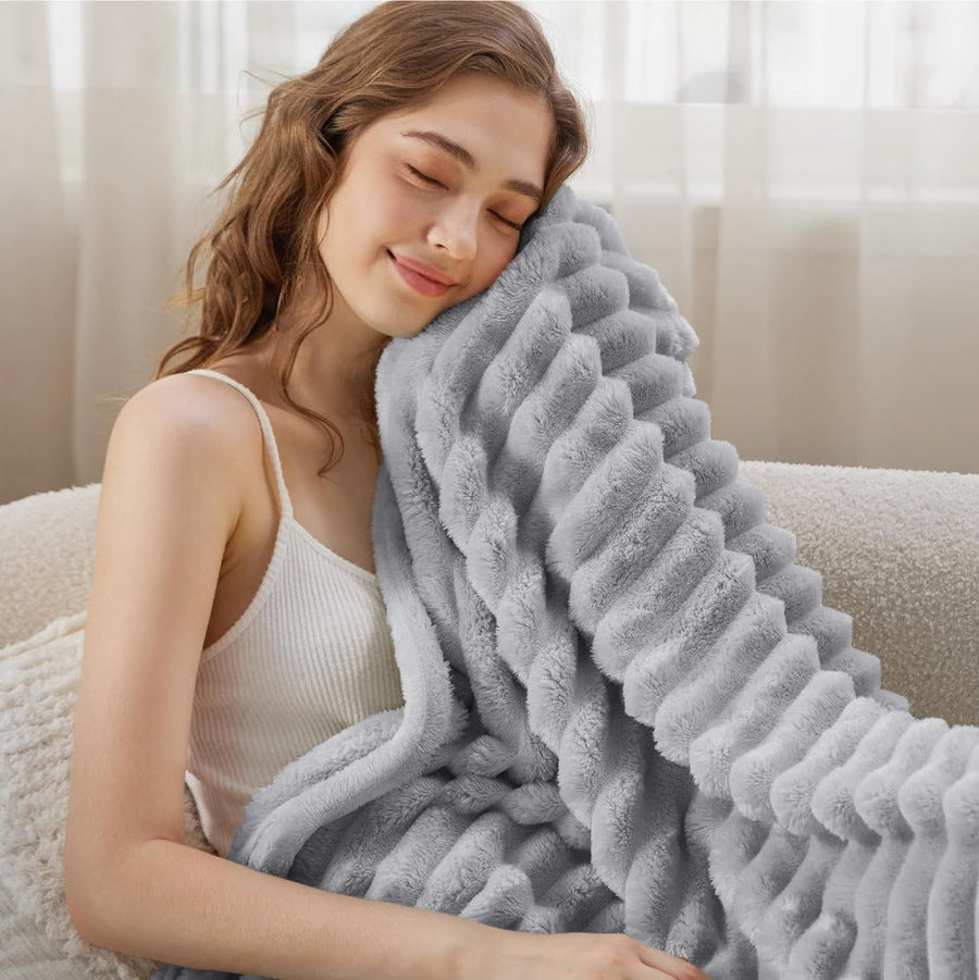 Soft texture detail of a striped throw blanket
