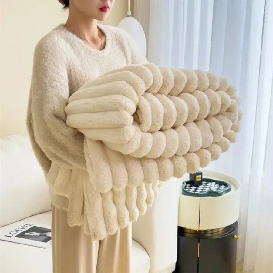 Close-up of blanket fringe and stripe detail
