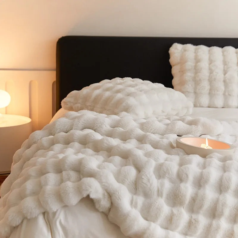 Throw blanket used as a cozy layer on a reading chair