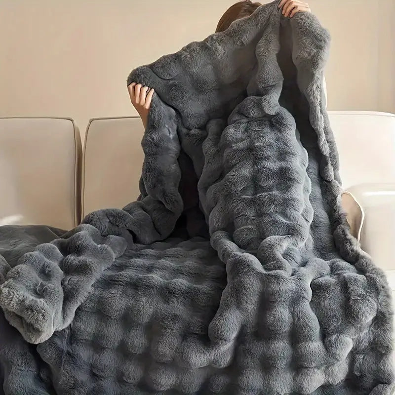 Ivory Cream throw blanket laid across a bed