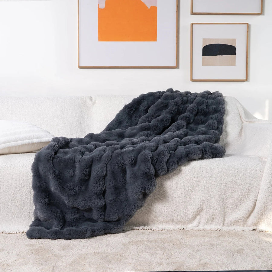 Person wrapped in the soft throw blanket