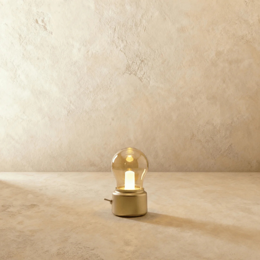 Gold retro bulb lamp standing on a nightstand