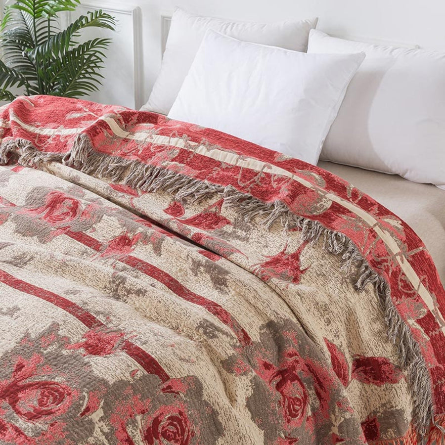 Textured floral throw blanket draped over furniture