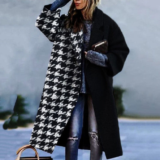 Woman wearing a long winter trench coat, front view