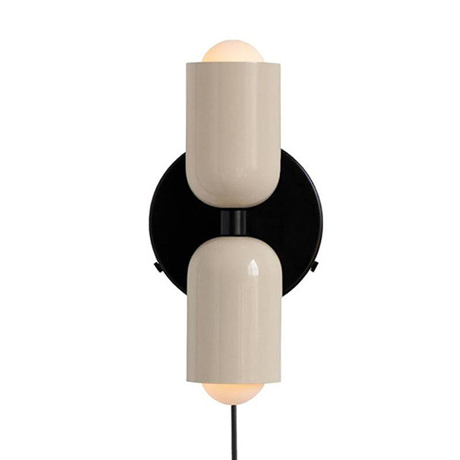 Wall sconce shown in a hallway setting with warm light