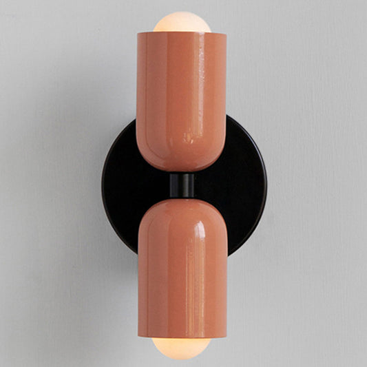 Scandinavian double wall sconce mounted on a light wall