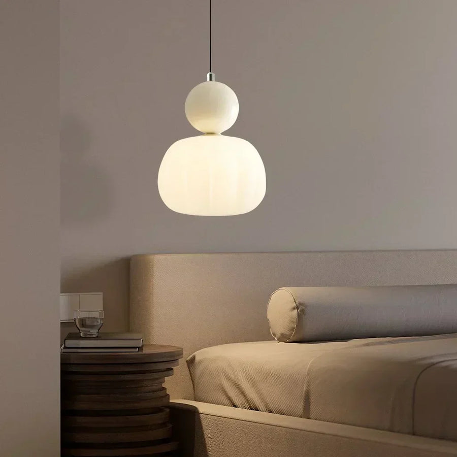 Pendant light glowing with white light in a living room setting