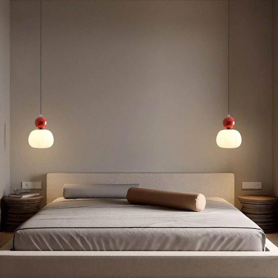 Three-head Art Deco pendant light illuminated with warm light