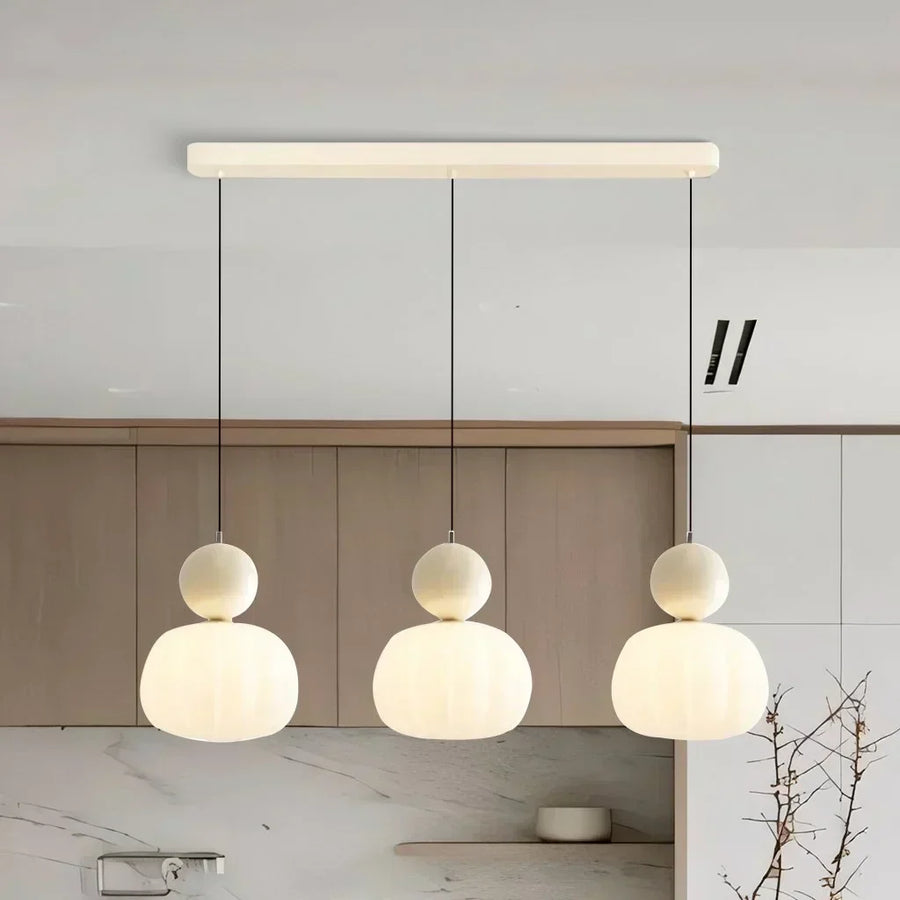 Red pendant light hanging in a hallway setting