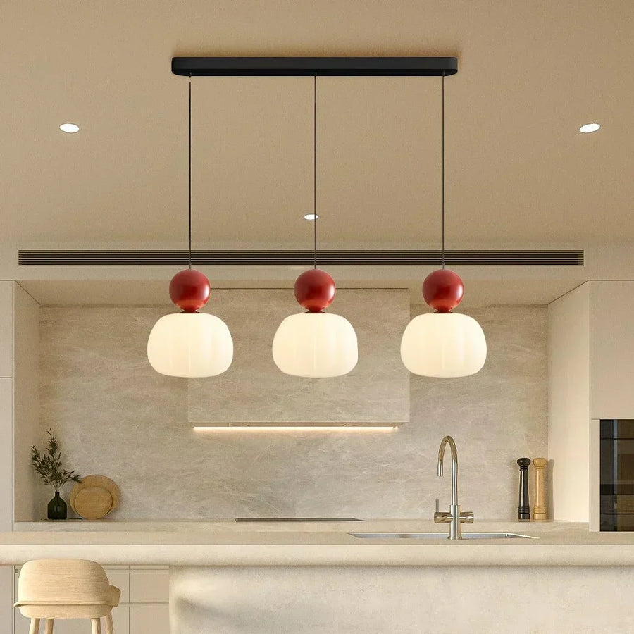 Pendant light shown next to a sofa in a living room