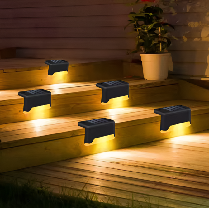 Close-up of solar outdoor lights mounted on a fence