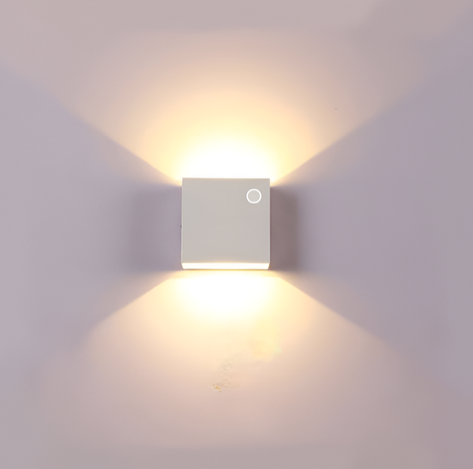 Outdoor wall lamp installed near an entryway door