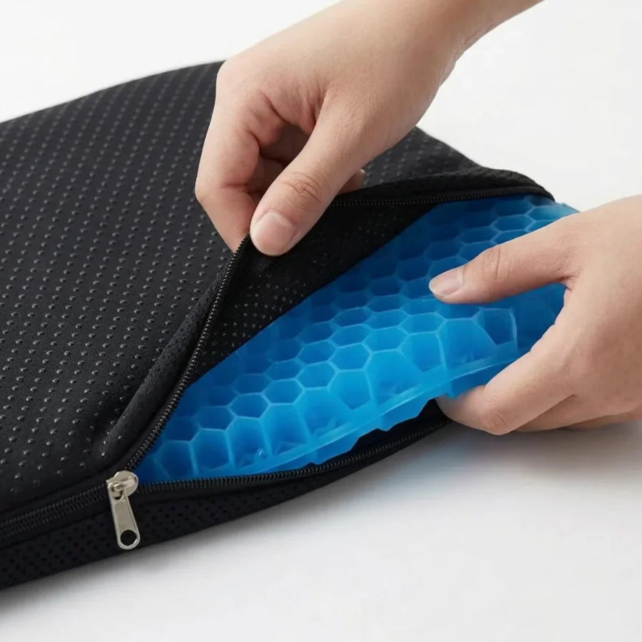 Cushion flexed by hand to show its soft, pliable material.