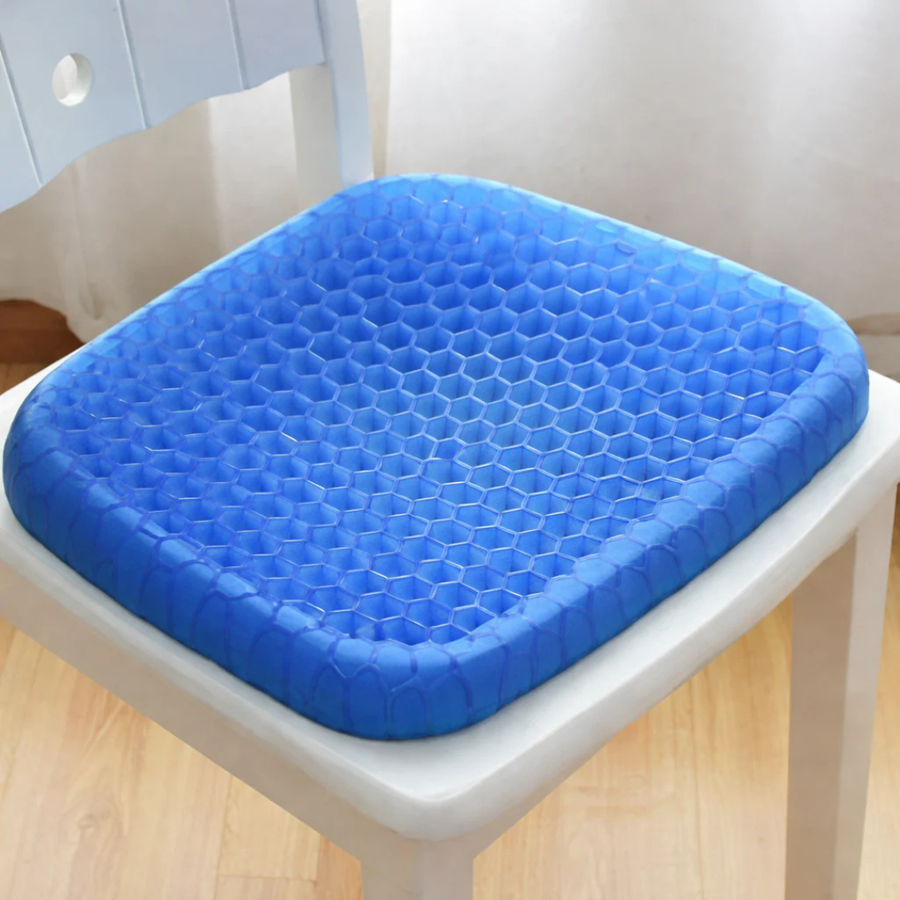 Silicone cushion placed next to a chair for size reference.
