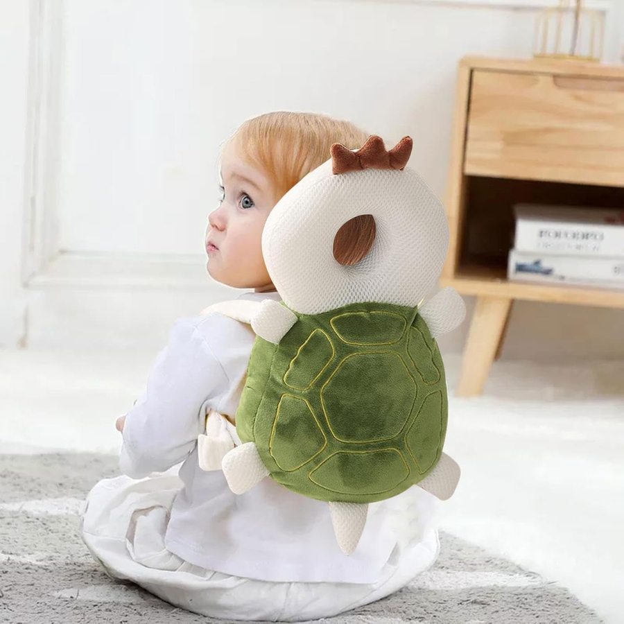 Turtle-shaped head protection cushion shown on its own against a plain background