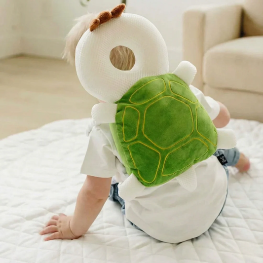 Baby wearing a turtle-shaped head protection cushion while crawling