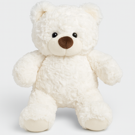 White fluffy plush teddy bear sitting in a woven basket