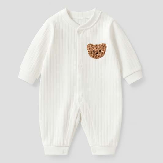 White ribbed baby overall with a crocheted bear patch on the chest
