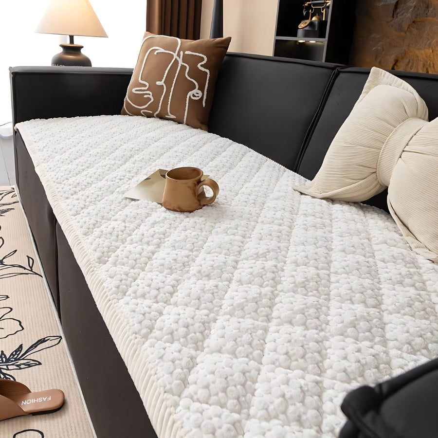 Knit non-slip sofa cover shown in a living room setting