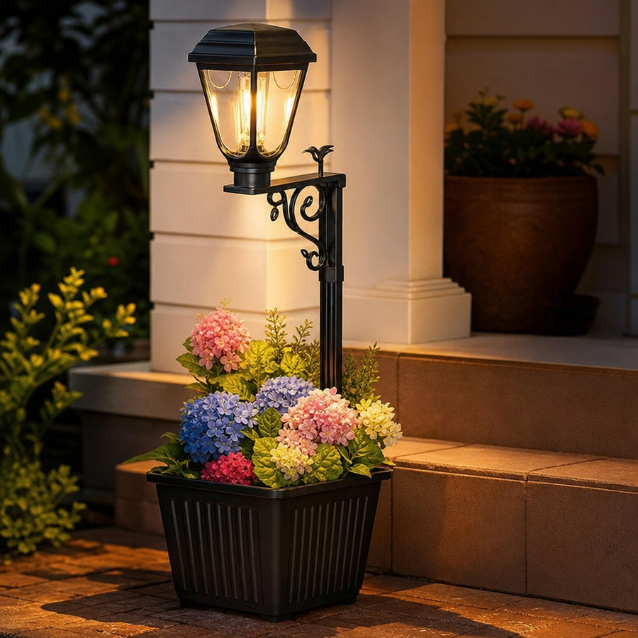 Solar garden lamp with a planter insert holding artificial flowers