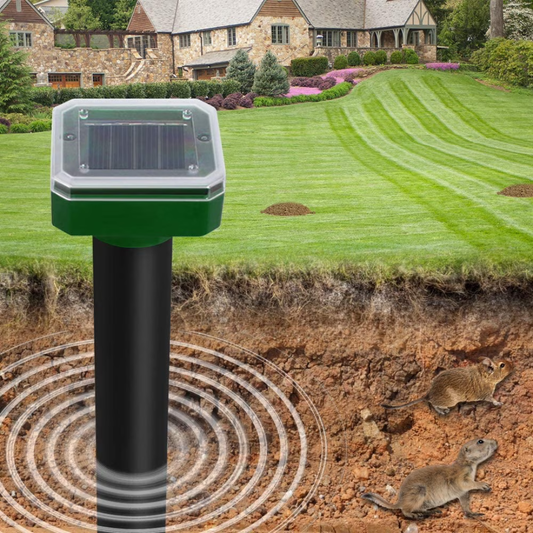 Solar-powered rodent repellent stake set against a garden backdrop