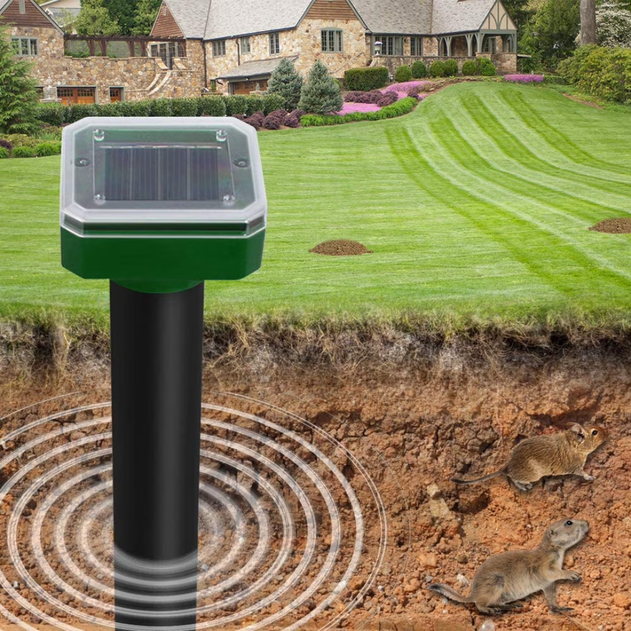 Solar-powered rodent repellent stake set against a garden backdrop