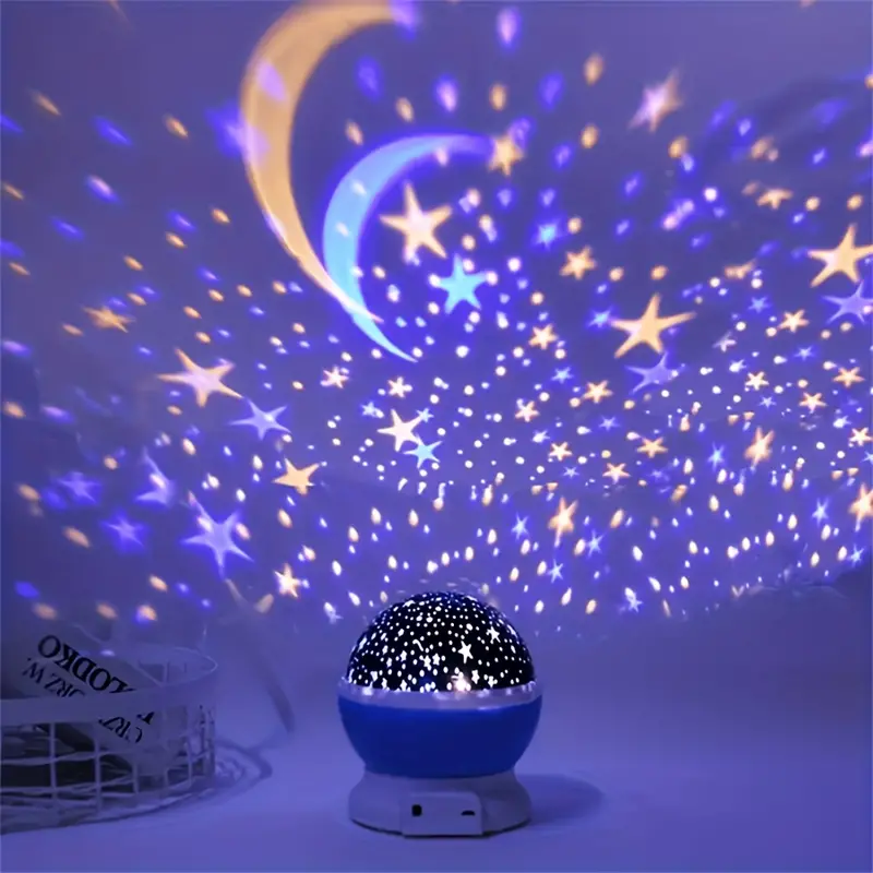 Pink galaxy projector glowing on a nightstand