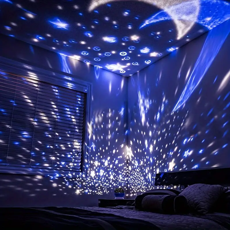 Blue galaxy projector sitting on a living room shelf