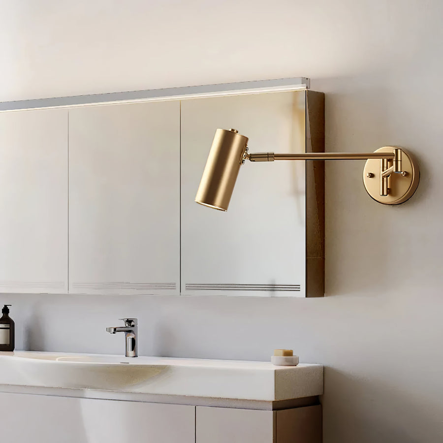 Wall lamp shown next to a bed in a bedroom