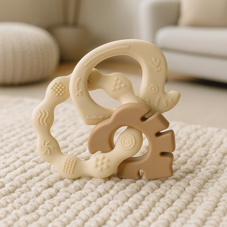 Beige and brown teether trio arranged to show its linked ring shapes.