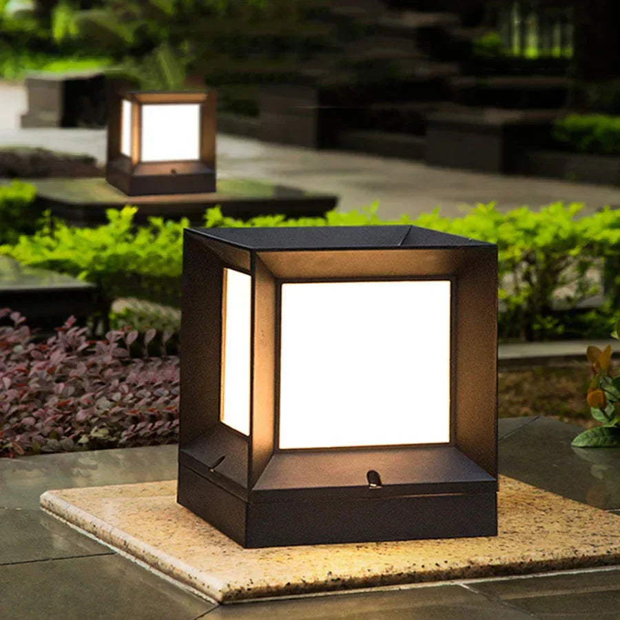 Outdoor pillar gate lamp illuminated at dusk