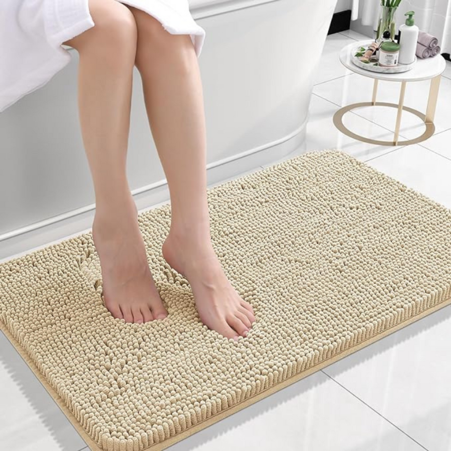 Bath mat shown next to a bathtub