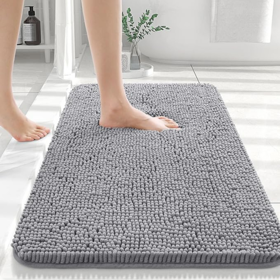 Bath mat placed in front of a sink