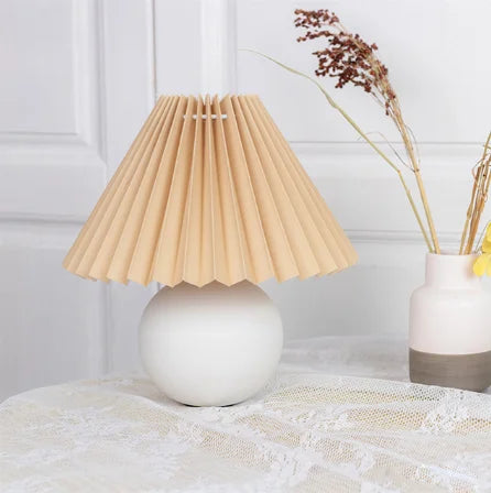 Table lamp shown in wine red and white color option