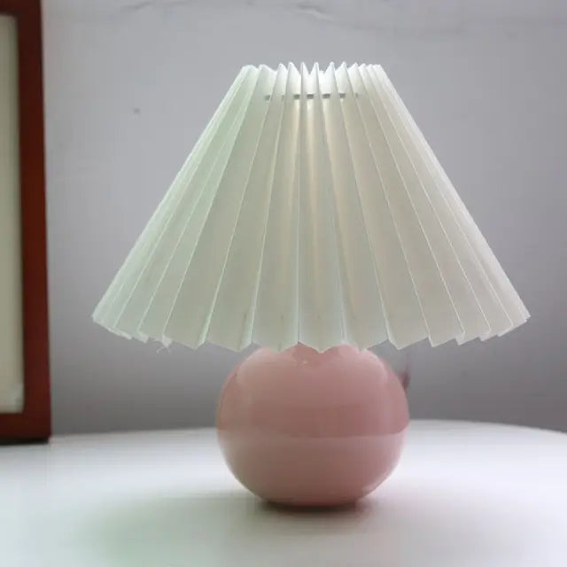 Table lamp shown turned on with warm light glow