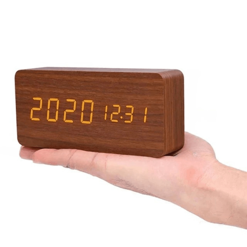 Triangular clock placed on a living room shelf