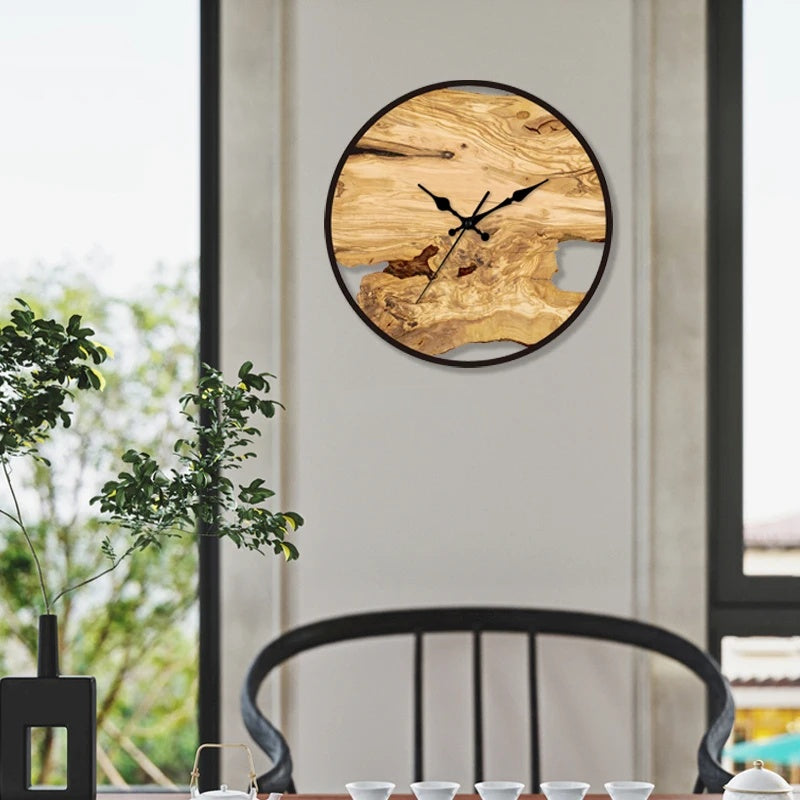 Close-up view of the transparent wall clock's face and hands.